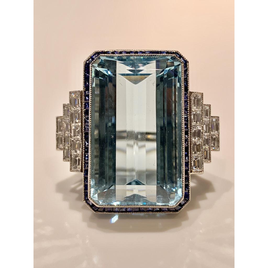Platinum Aqua With Sapphire Halo & 3 Tier Emerald Cut Steps